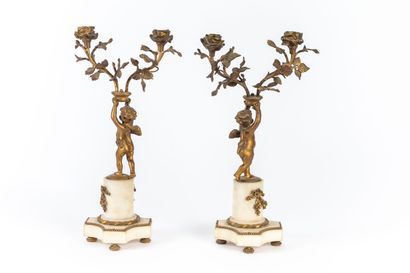 null Pair of two-light candelabras in white marble and gilt bronze, representing...