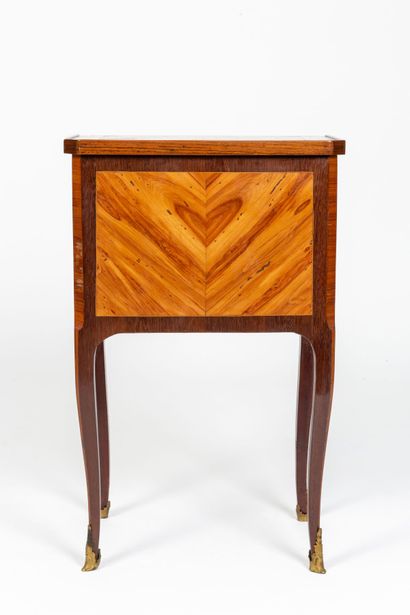 null Bedside table in marquetry of rosewood and violet wood decorated with frames.

The...