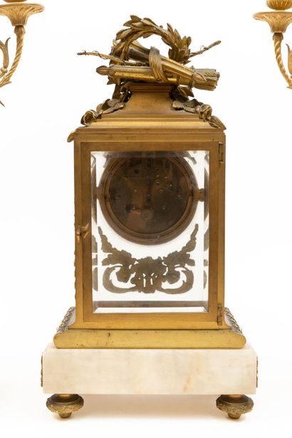 null Mantel set in chased and gilded bronze and alabaster, including a clock with...