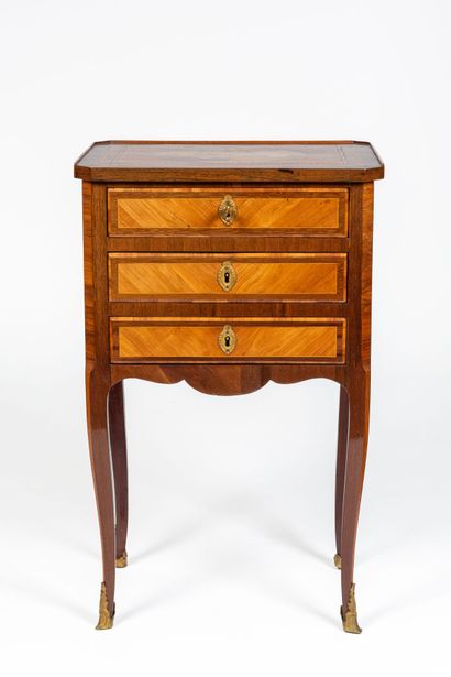 null Bedside table in marquetry of rosewood and violet wood decorated with frames.

The...