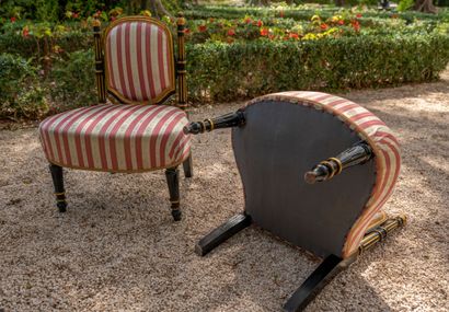 null Pair of small blackened and gilded wood armchairs, the backs supported by fluted...