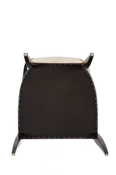 null Jean PASCAUD (1903-1996).

Office armchair in blackened wood with saber feet.

The...