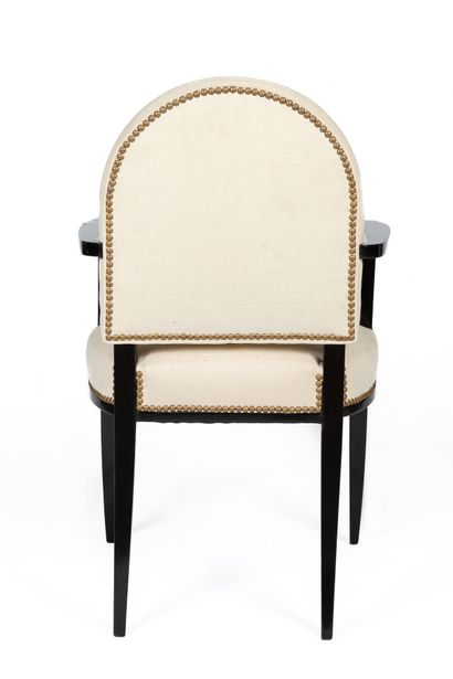 null Jean PASCAUD (1903-1996).

Office armchair in blackened wood with saber feet.

The...