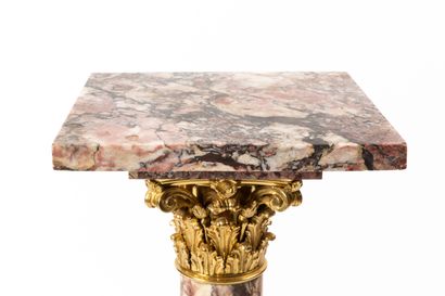 null Column in pink breccia marble, the swivel tray supported by a Corinthian capital.

Ornamentation...