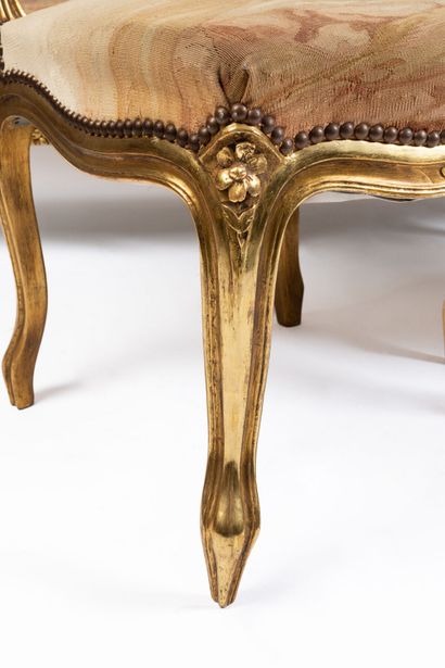 null Carved and gilded wood living room furniture including a sofa, a suite of four...