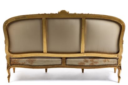 null Carved and gilded wood living room furniture including a sofa, a suite of four...