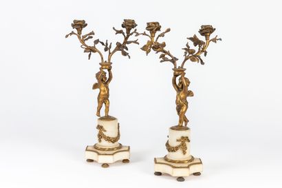 null Pair of two-light candelabras in white marble and gilt bronze, representing...