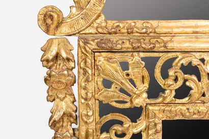 null Important carved and gilded wood mirror with openwork shells, flowers and stylized...