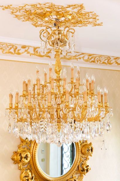 null 
Important chandelier with forty-two lights in gilded bronze and faceted glass...