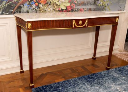 null Pair of mahogany and gilded wood consoles with belt and fluted legs. 

Polished...