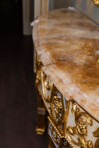 null ARMANDO RHO, Italy.

Half-moon console in carved and gilded wood with a rich...