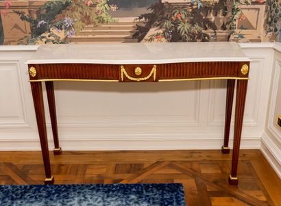 null Pair of mahogany and gilded wood consoles with belt and fluted legs. 

Polished...