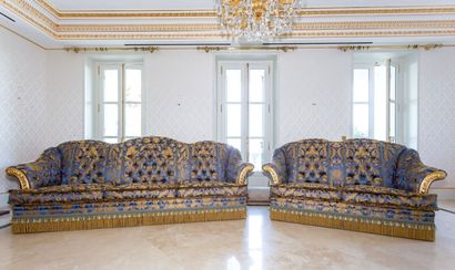 null ARMANDO RHO, Italy.

Two sofas upholstered in blue silk decorated with flowers...