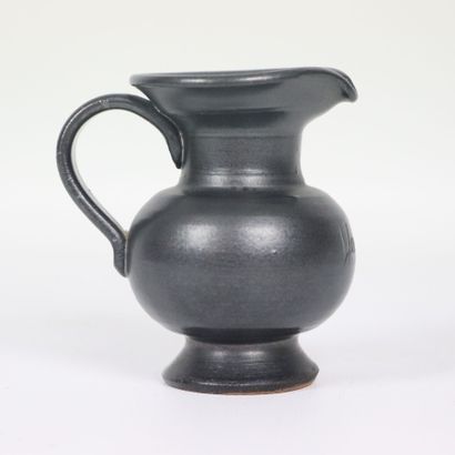 null Jean MARAIS (1913-1998). 

Miniature pitcher in black glazed terra cotta. 

Signed....