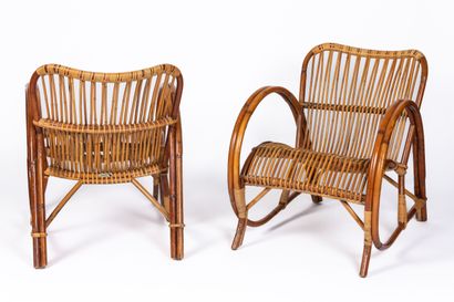 null AUDOUX-MINET.

Pair of rattan armchairs, curved arms.

Signed with their original...