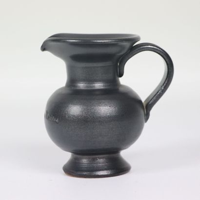 null Jean MARAIS (1913-1998). 

Miniature pitcher in black glazed terra cotta. 

Signed....