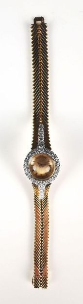 null BOUCHERON.
Yellow gold ladies' wristwatch, the case set with twenty brilliant-cut...