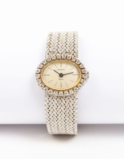 null MORABITO, Paris.
Ladies' wristwatch with white gold case and bracelet, the oval...