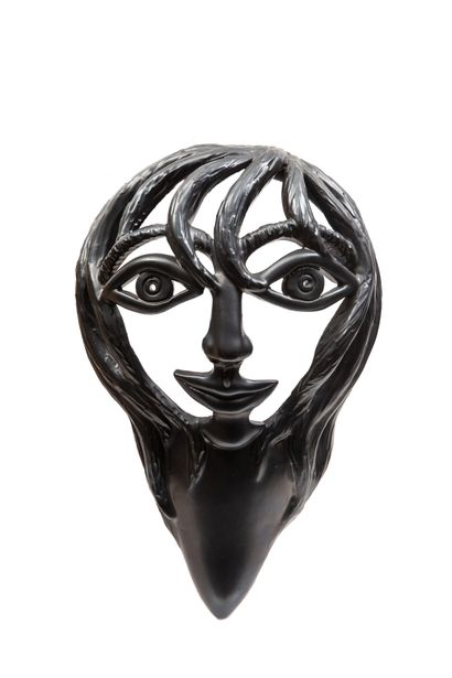 null Jean MARAIS (1913-1998).
Face of woman.
Sculpture of openwork in black ceramic,...