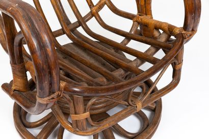 null AUDOUX-MINET, in the taste of. 
Important swivel armchair in dark rattan and...