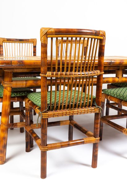 null AUDOUX-MINET.
Rare dining room table, and its six chairs with rattan legs.
The...