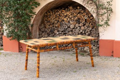 null AUDOUX-MINET.
Rare dining room table, and its six chairs with rattan legs.
The...