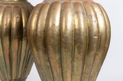 null Pair of large ornamental baluster vases in embossed copper alloy, decorated...