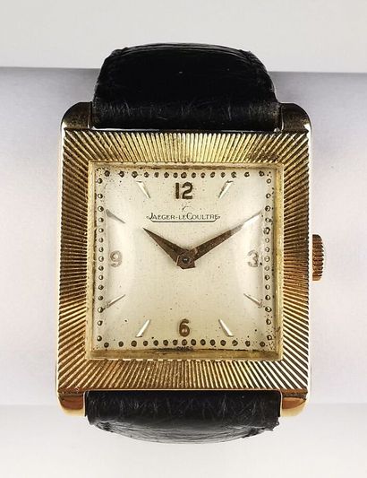 null JAEGER-LECOULTRE.
Yellow gold wristwatch, the square case with radiating decoration,...