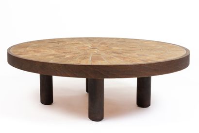null Roger CAPRON (1922-2006).
Circular coffee table, the tray decorated with ceramic...