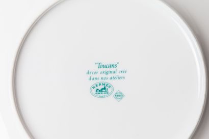 null HERMÈS, Paris.
Suite of twelve dessert plates, model "Toucan" in white enamelled...