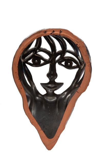 null Jean MARAIS (1913-1998).
Face of woman.
Sculpture of openwork in black ceramic,...