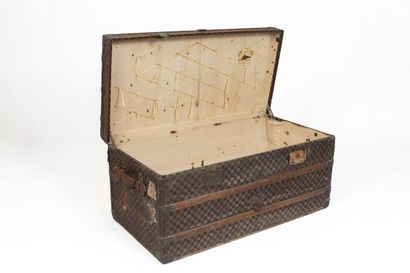 null MOYNAT, Paris.
Large mail trunk in coated canvas with checkerboard decoration,...