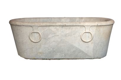null Oval bathtub in carved white marble, decorated in relief with two rings on one...