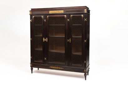 Bookcase in dark rosewood veneer and gilded...