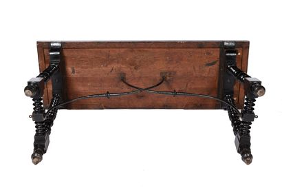 null Richly turned, stained and reblackened wood table with rectangular top.
Ringed...