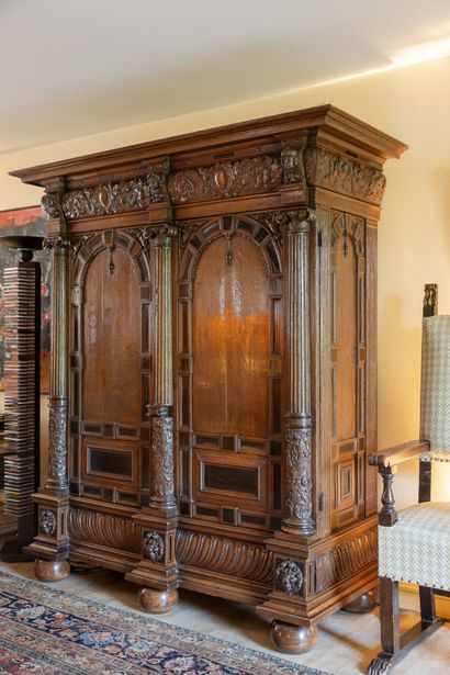 null Large carved oak armoire with ebony marquetry. 
It opens on two doors, and is...