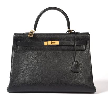null HERMÈS, Paris.
Kelly 35" bag in grained black taurillon leather with gold metal...