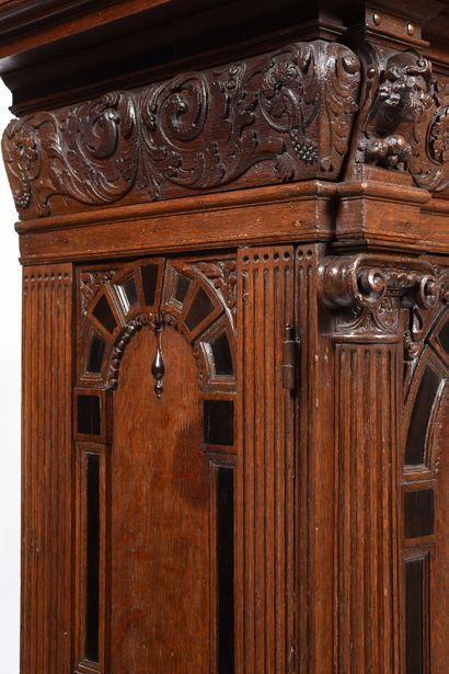 null Large carved oak armoire with ebony marquetry. 
It opens on two doors, and is...