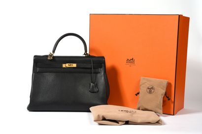 null HERMÈS, Paris.
Kelly 35" bag in grained black taurillon leather with gold metal...