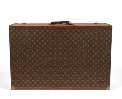 null LOUIS VUITTON, Paris.
Large rigid suitcase in monogram-coated canvas, with lozined...