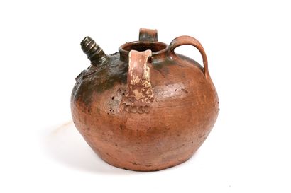 null Terracotta oil jug with brown-green glaze on part of the body.
The body is ribbed...