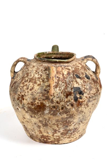 null Terracotta oil jug with green glaze, on part of the body.
Decorated with doves...