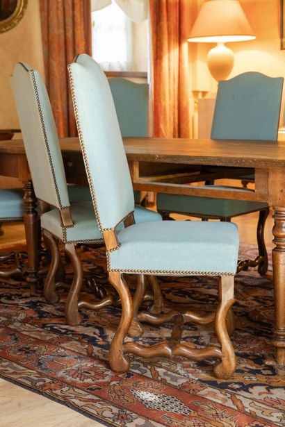 null Suite of fourteen sheepskin chairs.
Eight with modern blue cotton upholstery,...