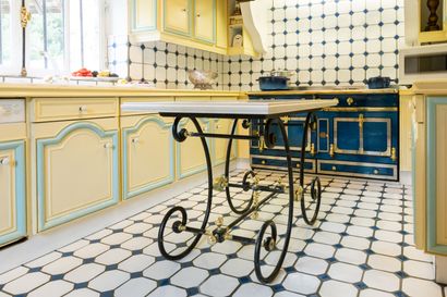null Butcher's table with wrought-iron legs and gilded brass trimmings.
Polished...