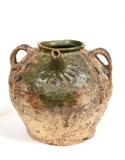 null Terracotta oil jug with green glaze, on part of the body.
Decorated with doves...