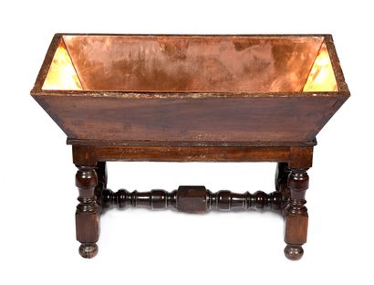 null Patinated walnut kneading trough with turned base. 
Complete with copper interior,...