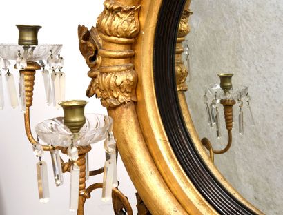 null Large witch mirror in wood and gilded stucco. 
It is adorned with four associated...