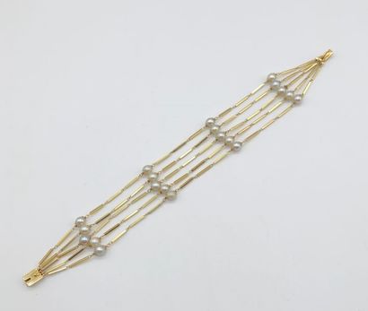 null Bracelet cinq rangs, en or jaune 750, maille bâtons scandés de perles,

long...