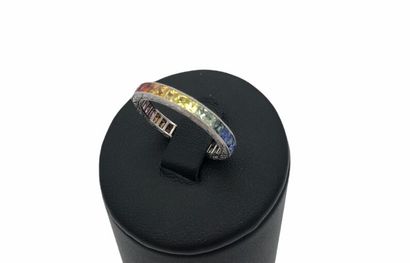 null *American wedding band in platinum, set with a rainbow of multicolored princess-cut...