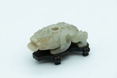 null CHINA - 17th century
Celadon jade (nephrite) dropper in the shape of a bixie,...